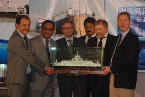 The shipyard team handing over a model of ISEFJORD to the owners in presence of the Danish Ambassador